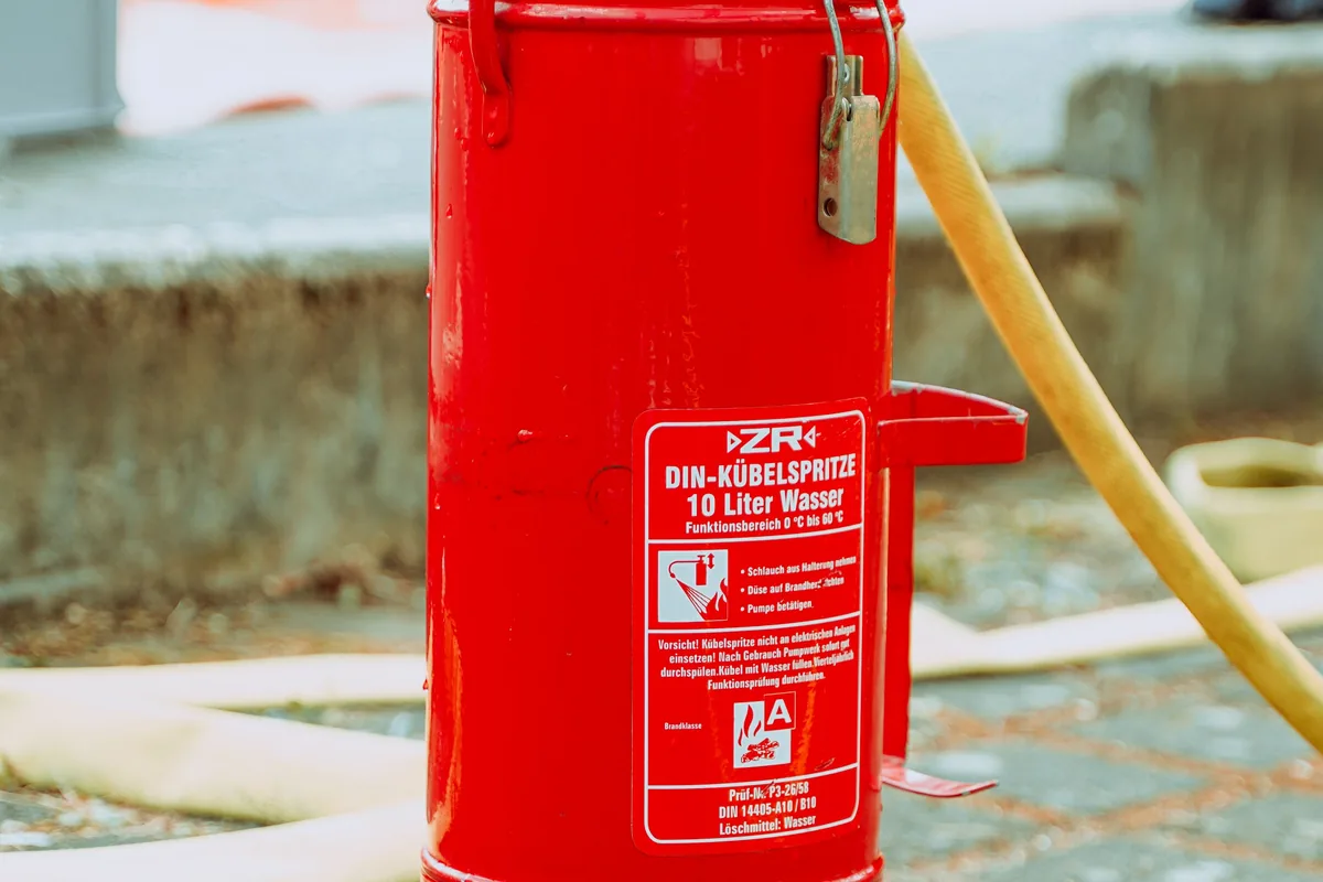 Red portable fire extinguisher